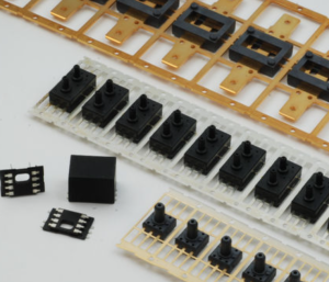 Molded plastic packages on leadframe